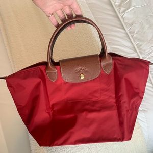 BRAND NEW- Longchamp le pliage bag in red! Great find, never used